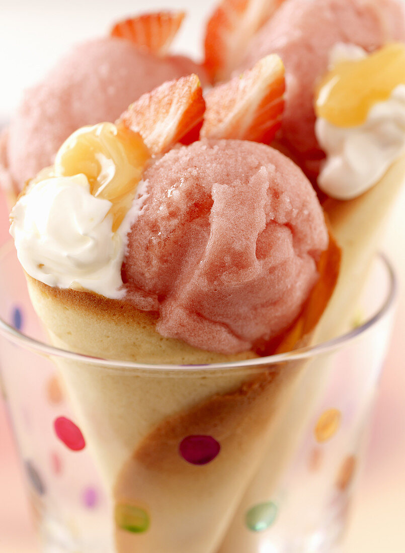 An ice cream cone filled with strawberry ice cream and lemon curd