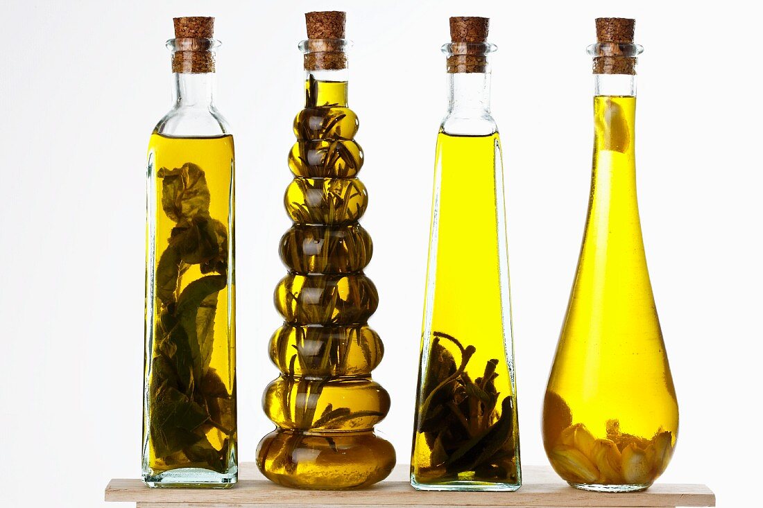 Bottles of olive oil with various aromas