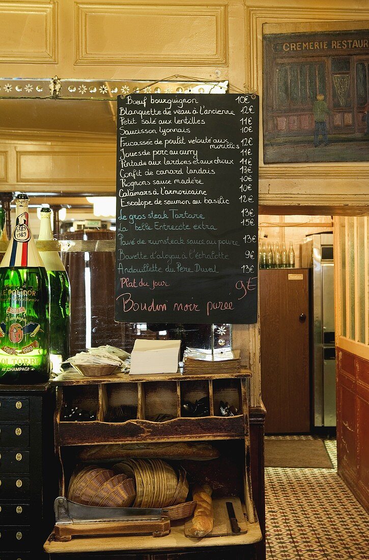 A menu board in a French restaurant