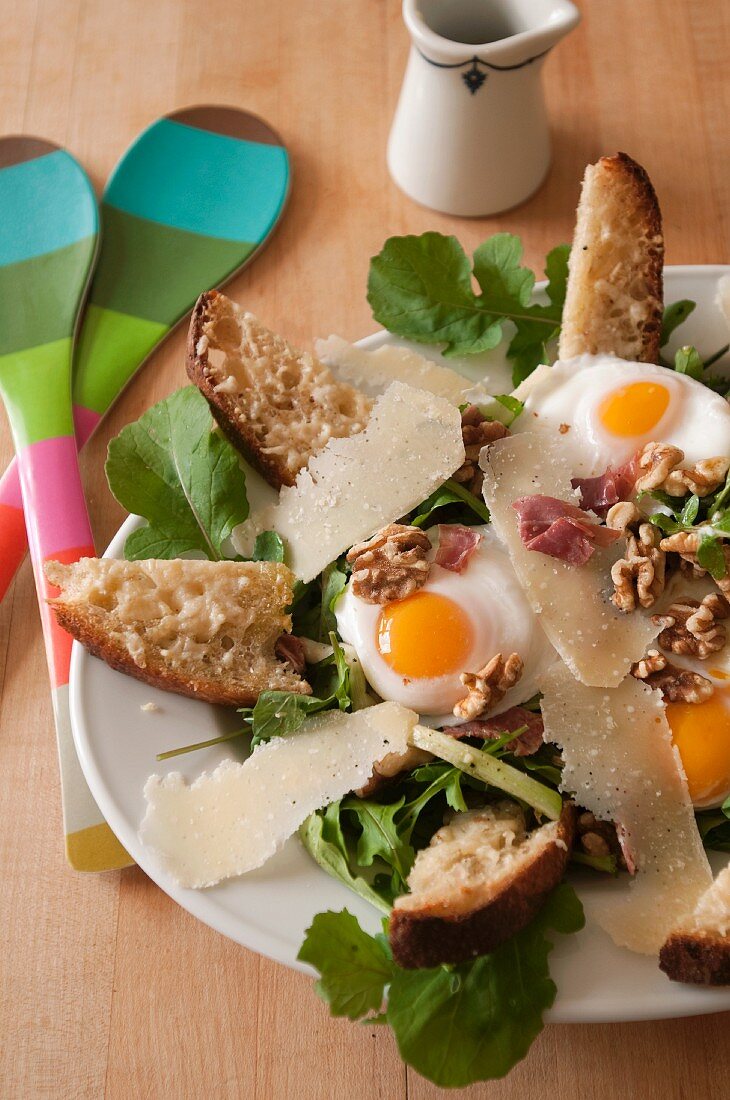 Salad with Arugula, Prosciutto, Fried Egg, Walnuts, Parmesan and Cheese Toasts