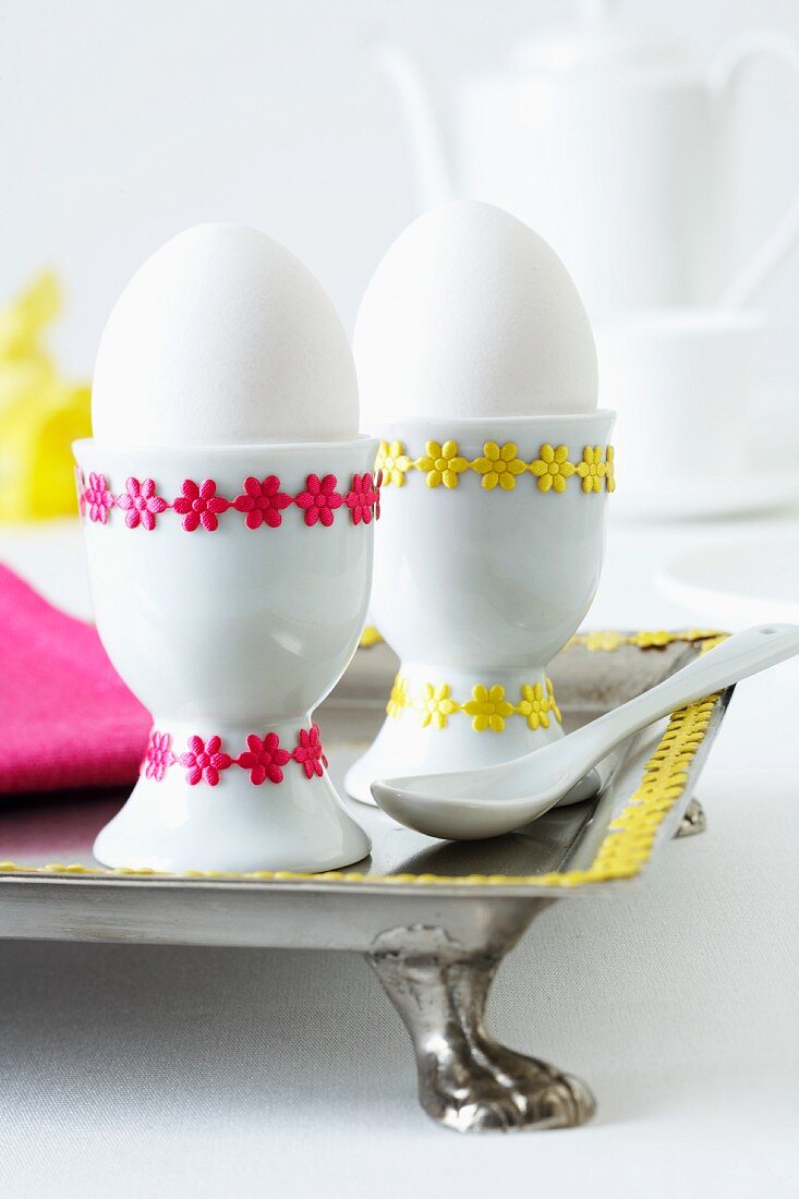 Egg cups decorated with self-adhesive ribbons