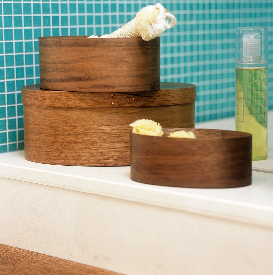 Wooden boxes on a shelf in a bathroom