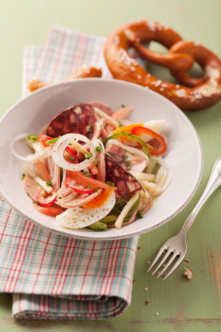 Meat salad with cheese and egg