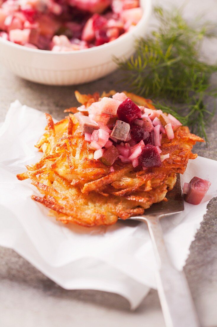 Herring salad with beetroot and potato cakes