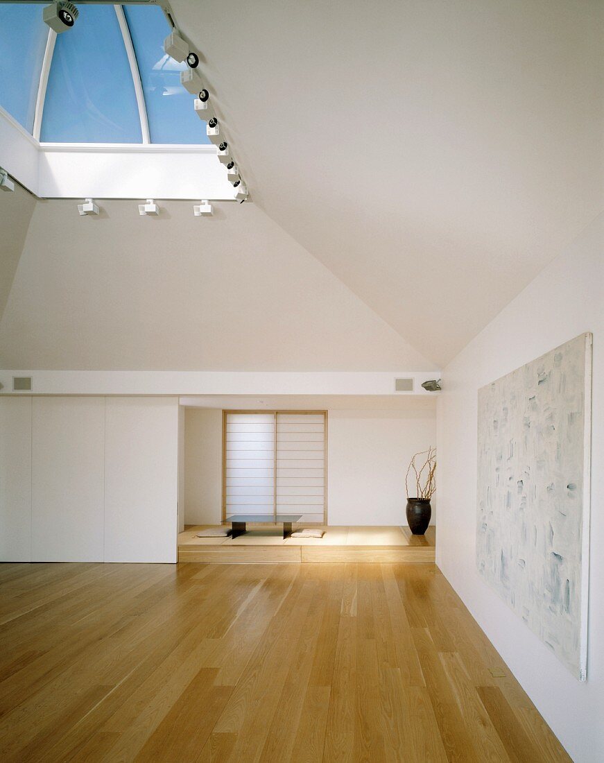 An empty Oriental-style living room or meditation room with a skylight