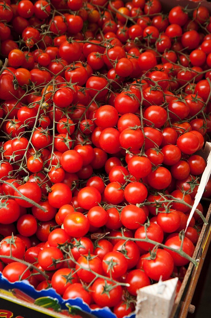 Cherry tomatoes in a wooden crate