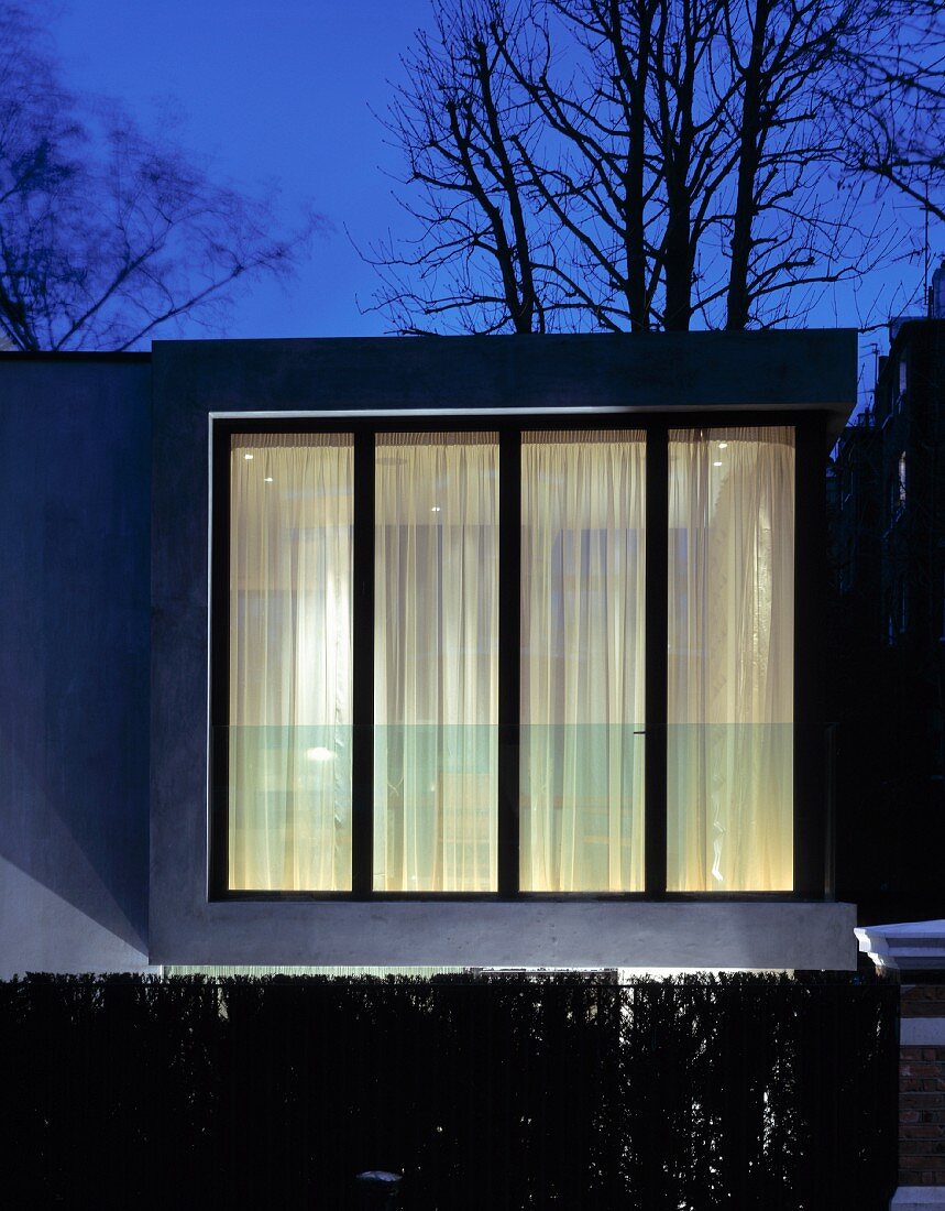 Illuminated contemporary house in the evening