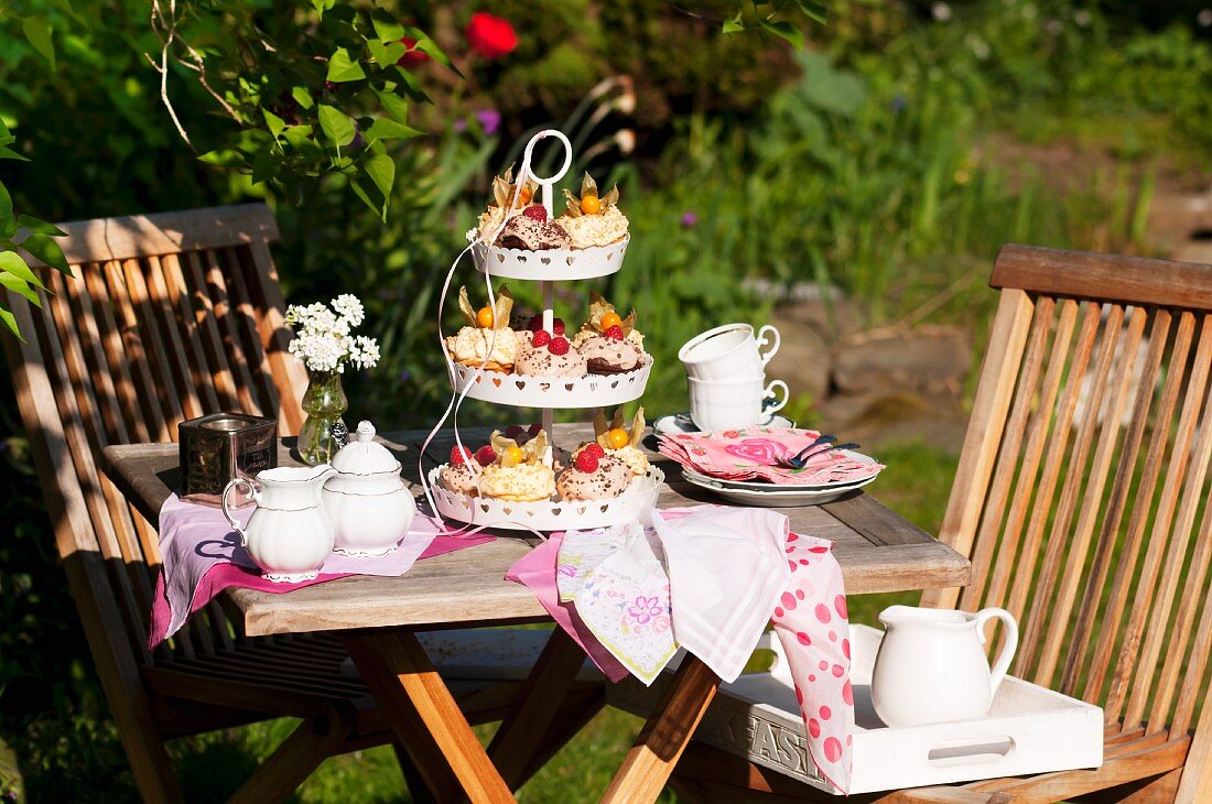 Cupcakes on a cake stand on a garden table