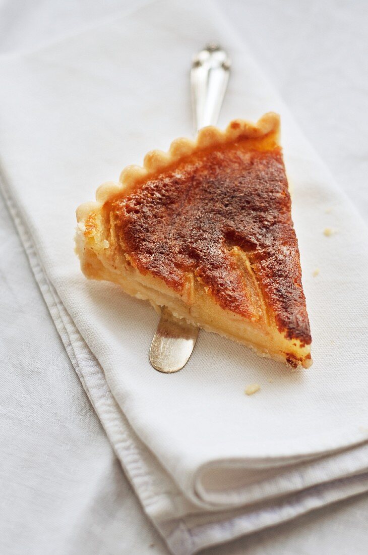 A slice of pear and almond tart