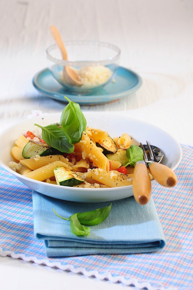 Penne pasta with courgettes and basil