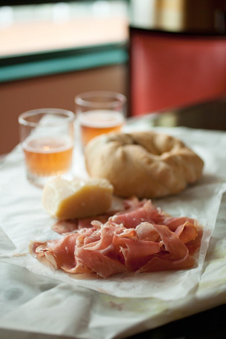 Prosciutto and Bread on a Table at an Italian Market in Baltimore Maryland