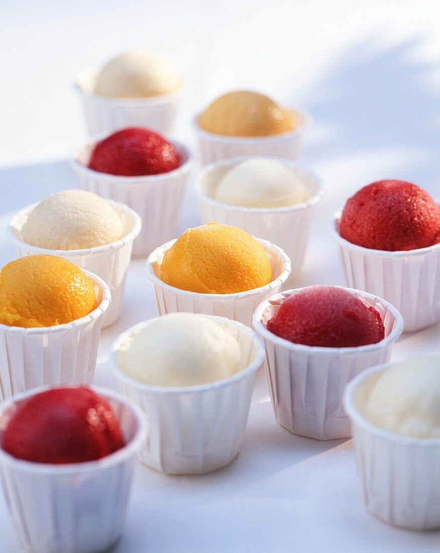 Various types of fruit ice cream in cups