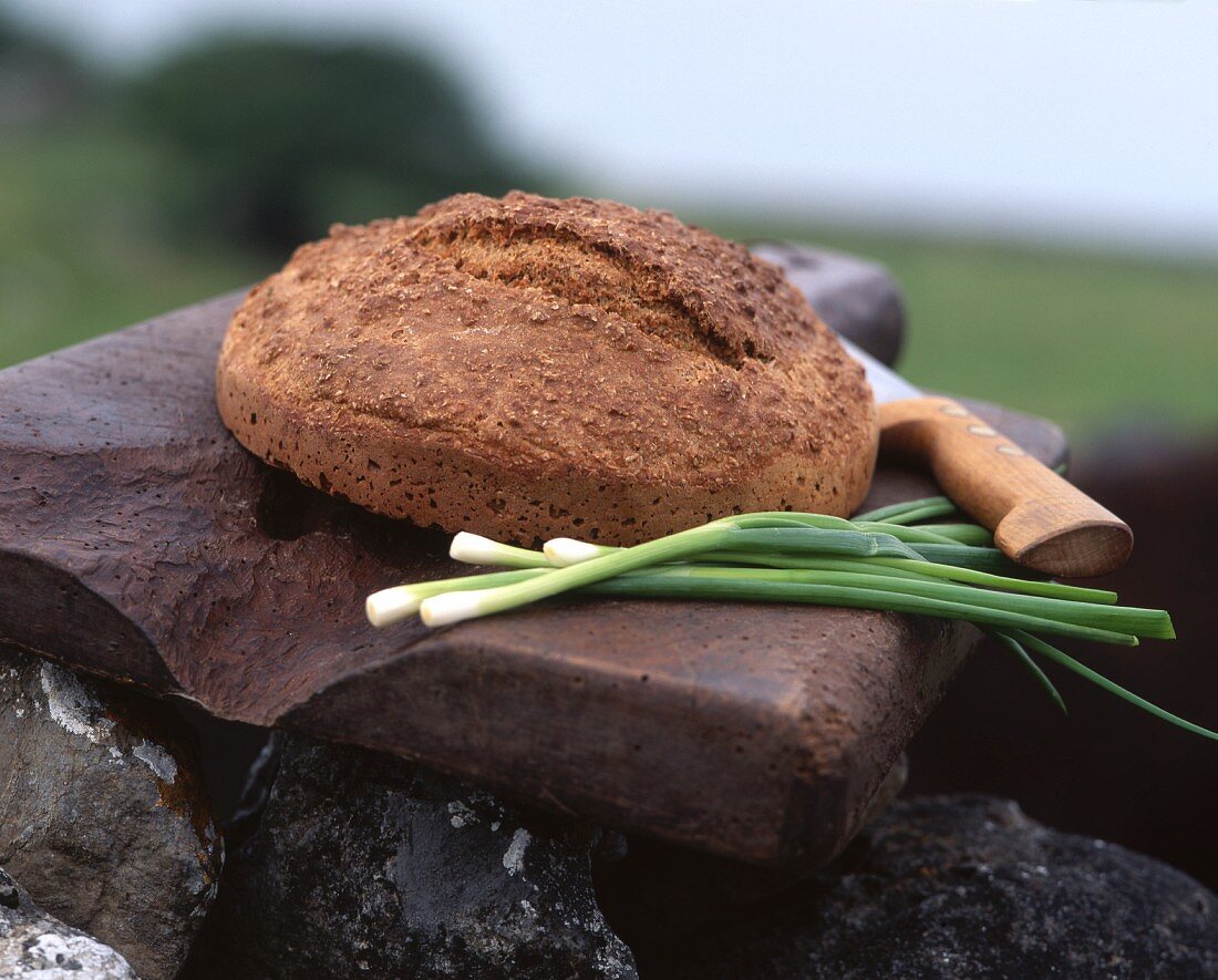 A loaf of bread on a stone slab in the open air (Ireland)