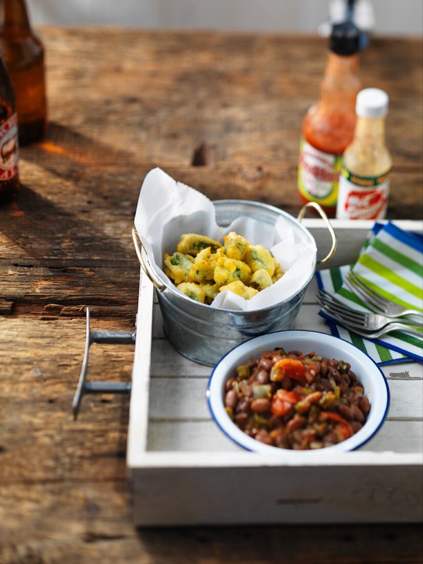 Side dishes for a barbecue:battered okra and baked beans (USA)