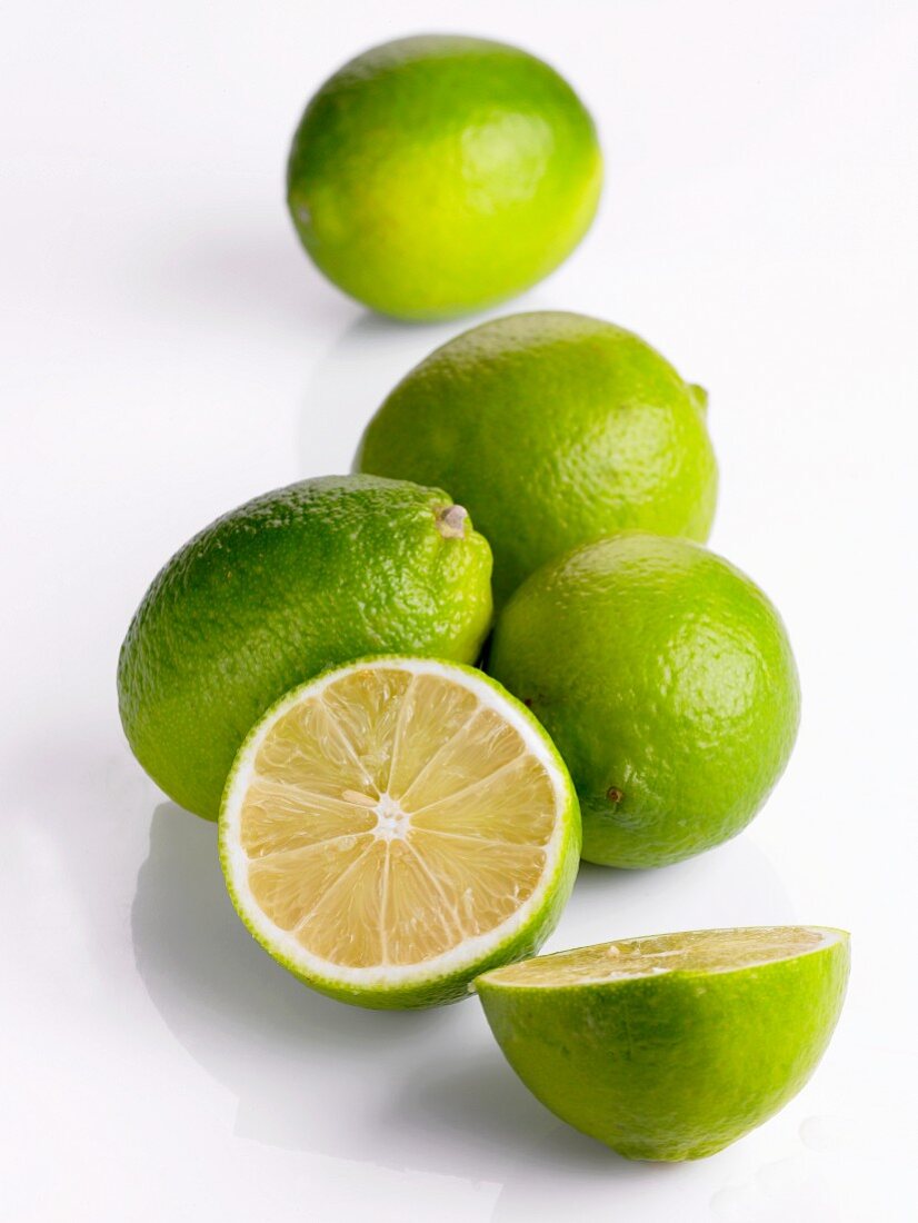 Several limes, whole and halved