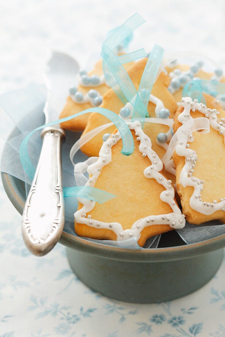 Christmas tree biscuits with ribbons for hanging up