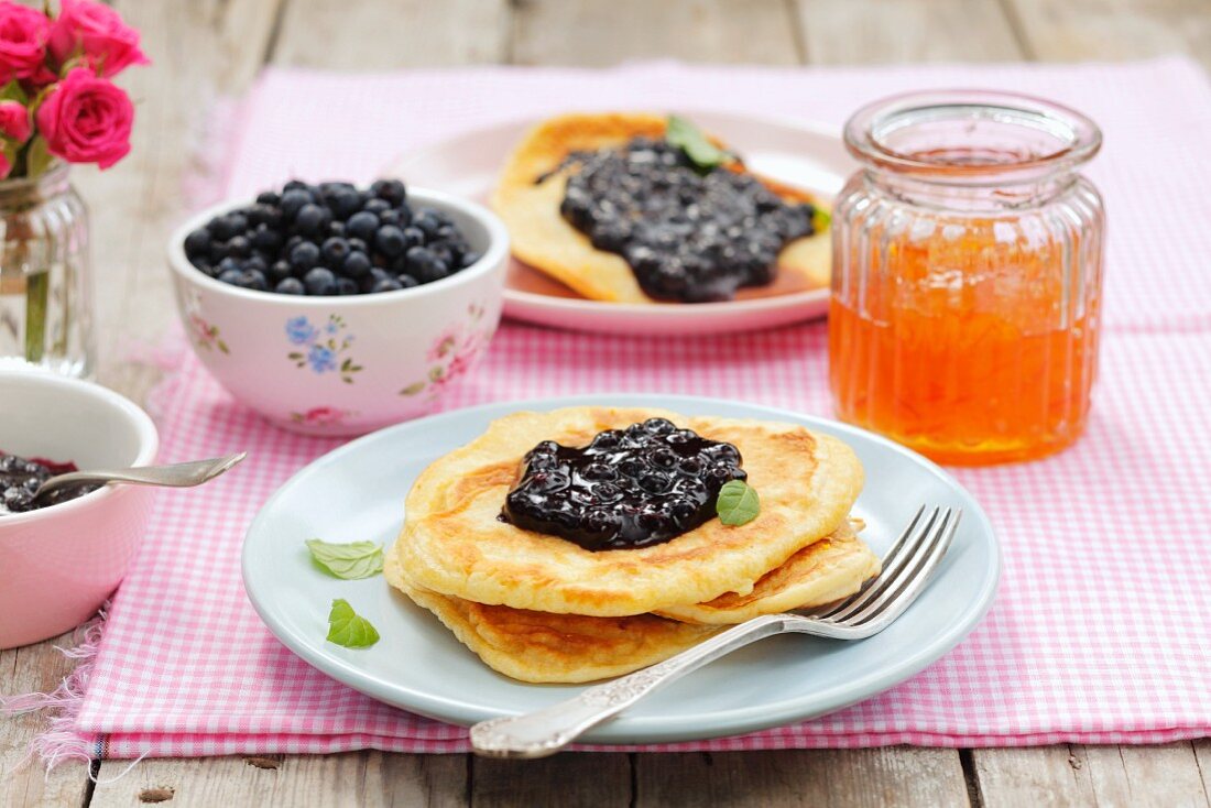 Pancakes with blueberry jam, blueberries and marmalade