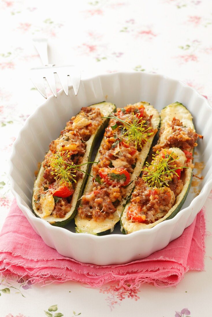 Courgettes stuffed with minced meat, pearl barley and tomatoes