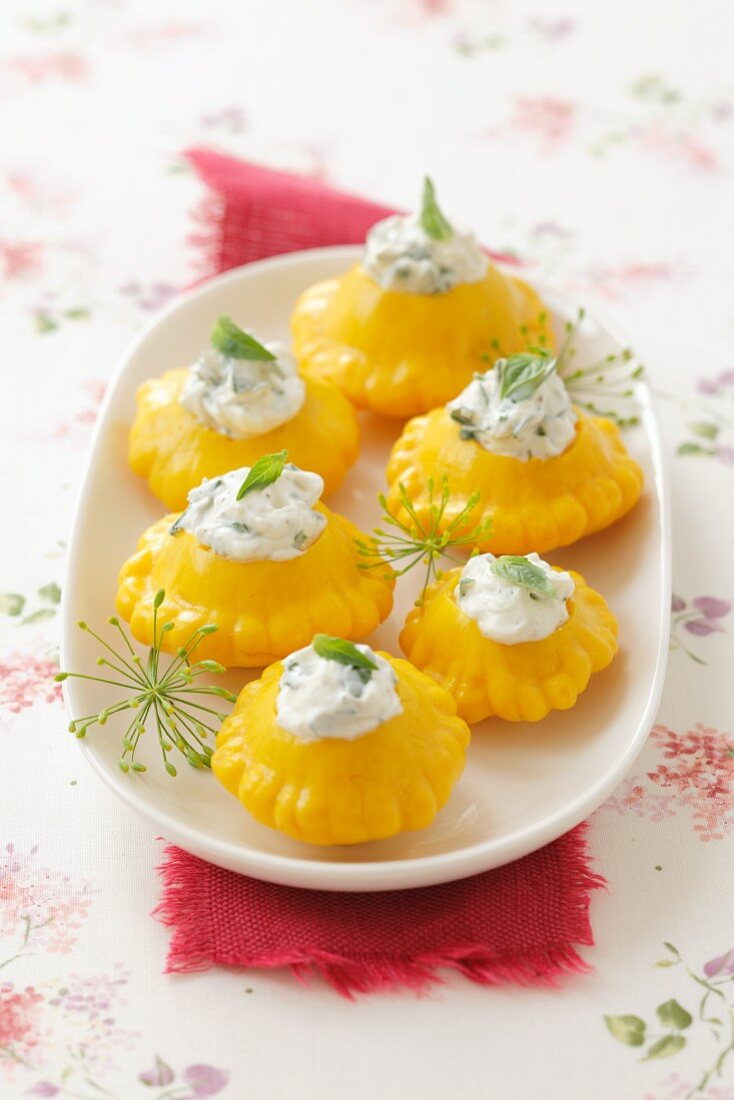 Pickled pattypan squashes filled with cream cheese and basil