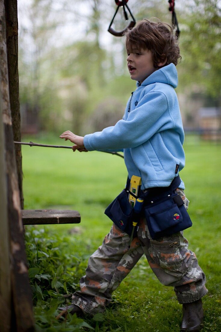 A boy working in a garden