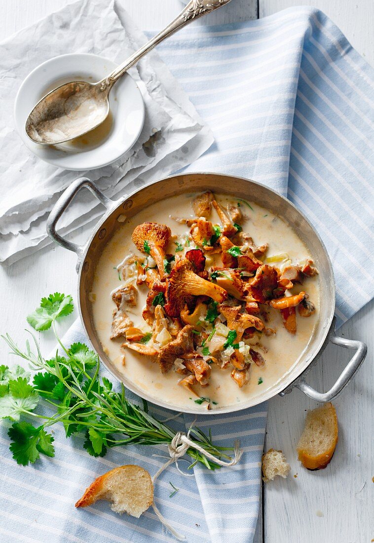 Braised chanterelle mushrooms in a creamy sauce with parsley