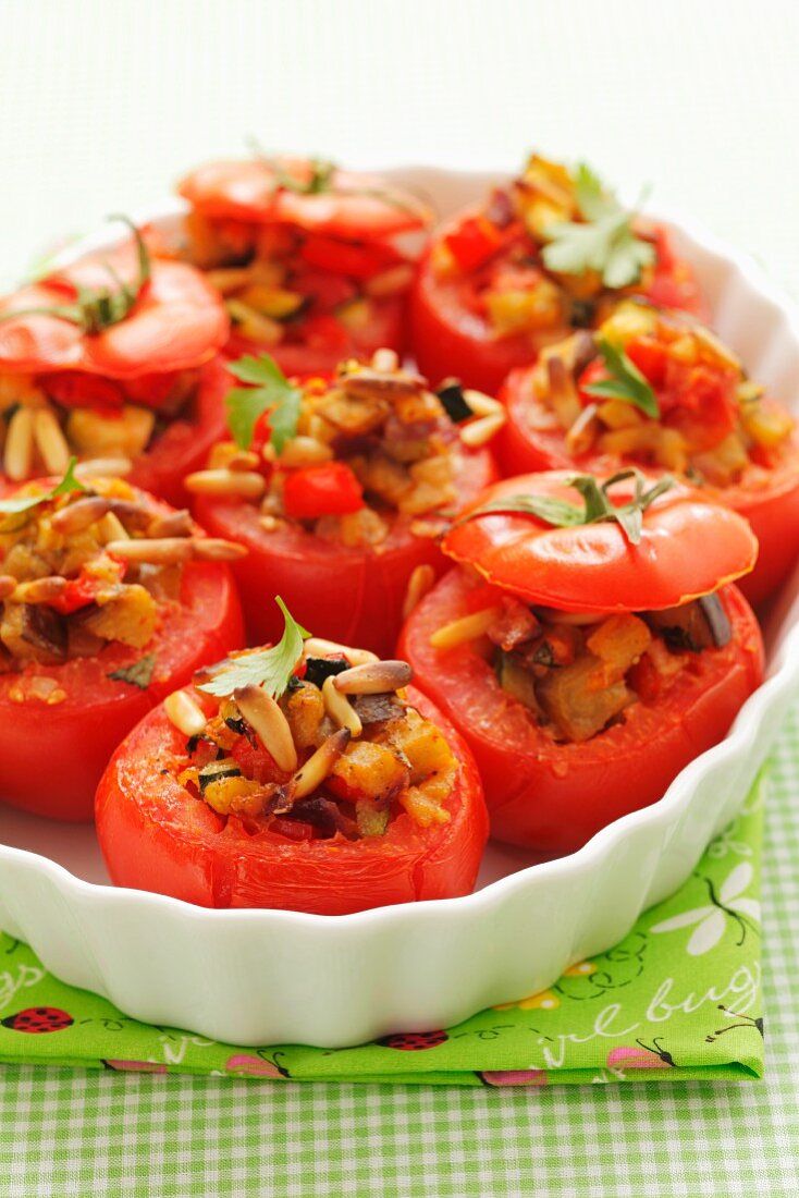 Tomatoes stuffed with ratatouille and pine nuts
