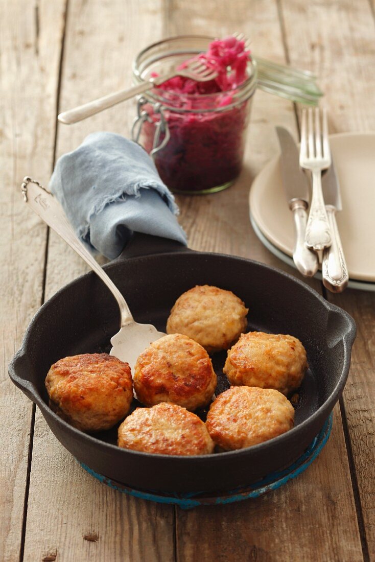 Pork and chicken burgers and red cabbage salad