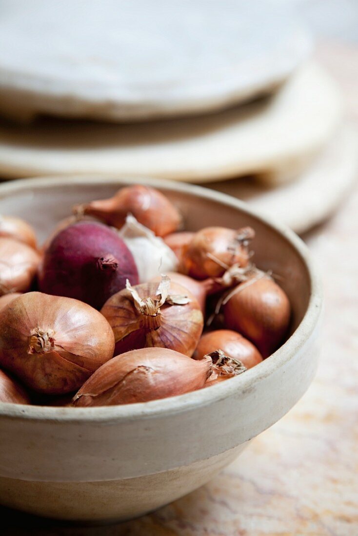 Onions in clay bowl