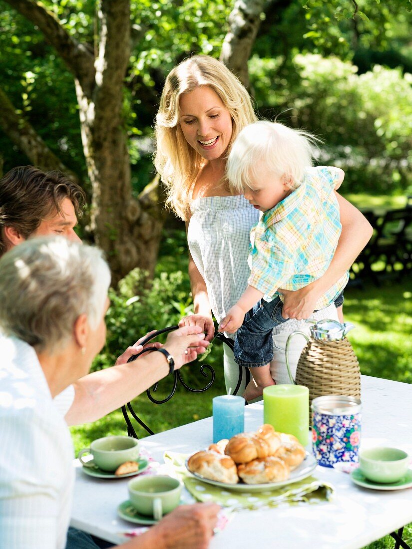 A family having coffee in a garden