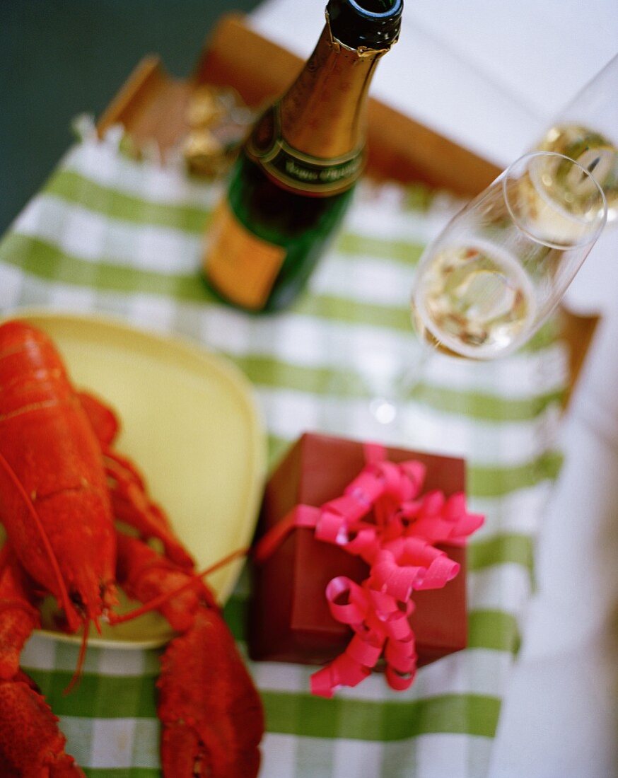 A man bringing a woman champagne breakfast in bed