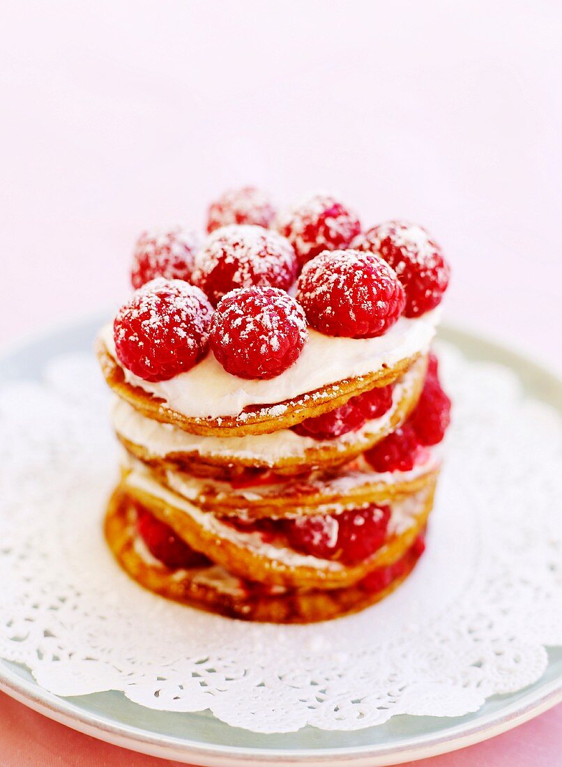 Pancakes with raspberries and icing sugar