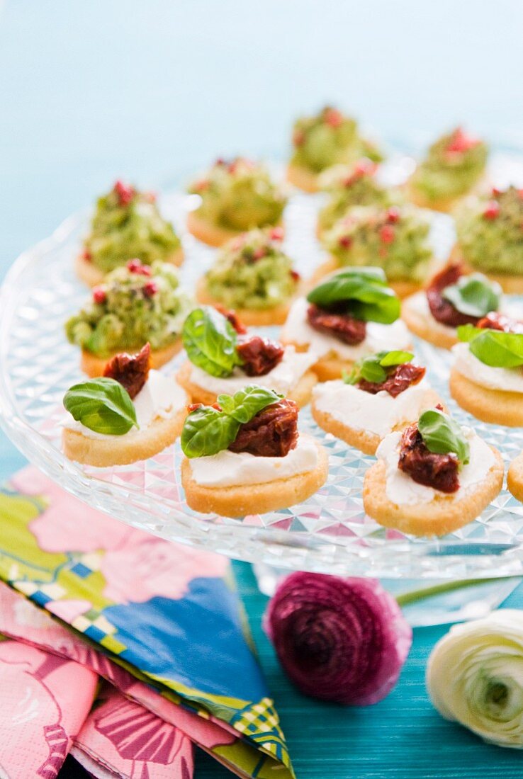 Various canapes on a glass plate