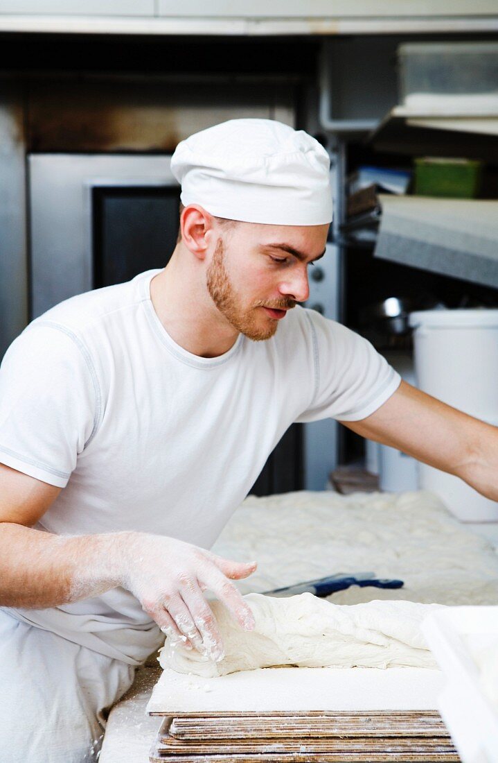 A backer working in a bakery