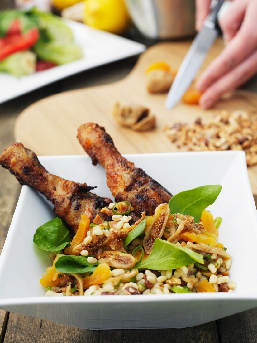 Chicken legs with dried fruits and barley