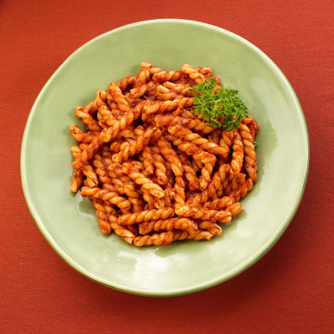 Plate of Gemelli Pasta in Marinara Sauce with Parsley Garnish