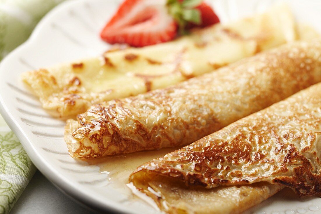 Folded Crepes on a Platter with Honey