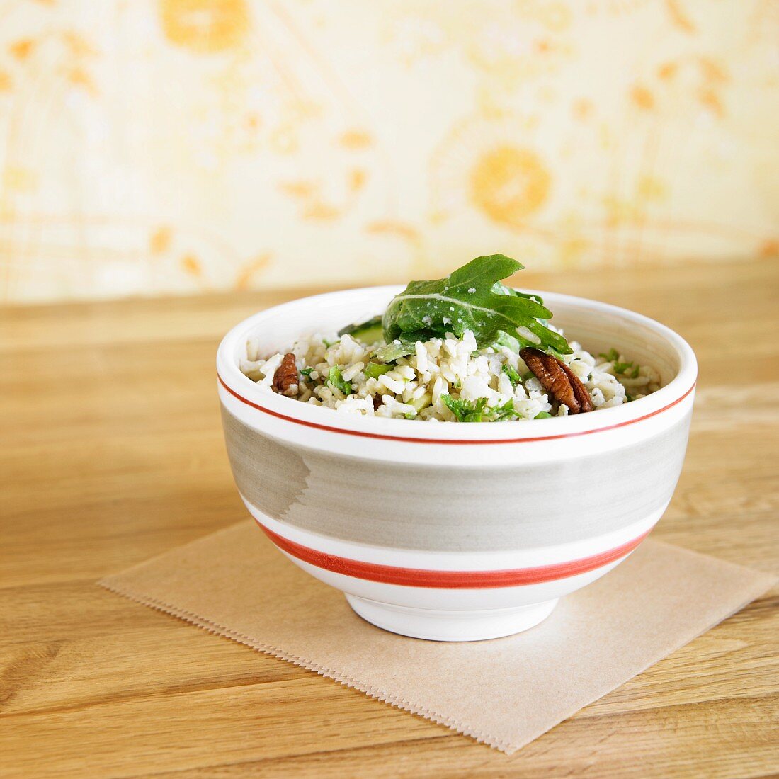 Bowl of Brown Rice with Zucchini, Arugula, Walnuts and Peas