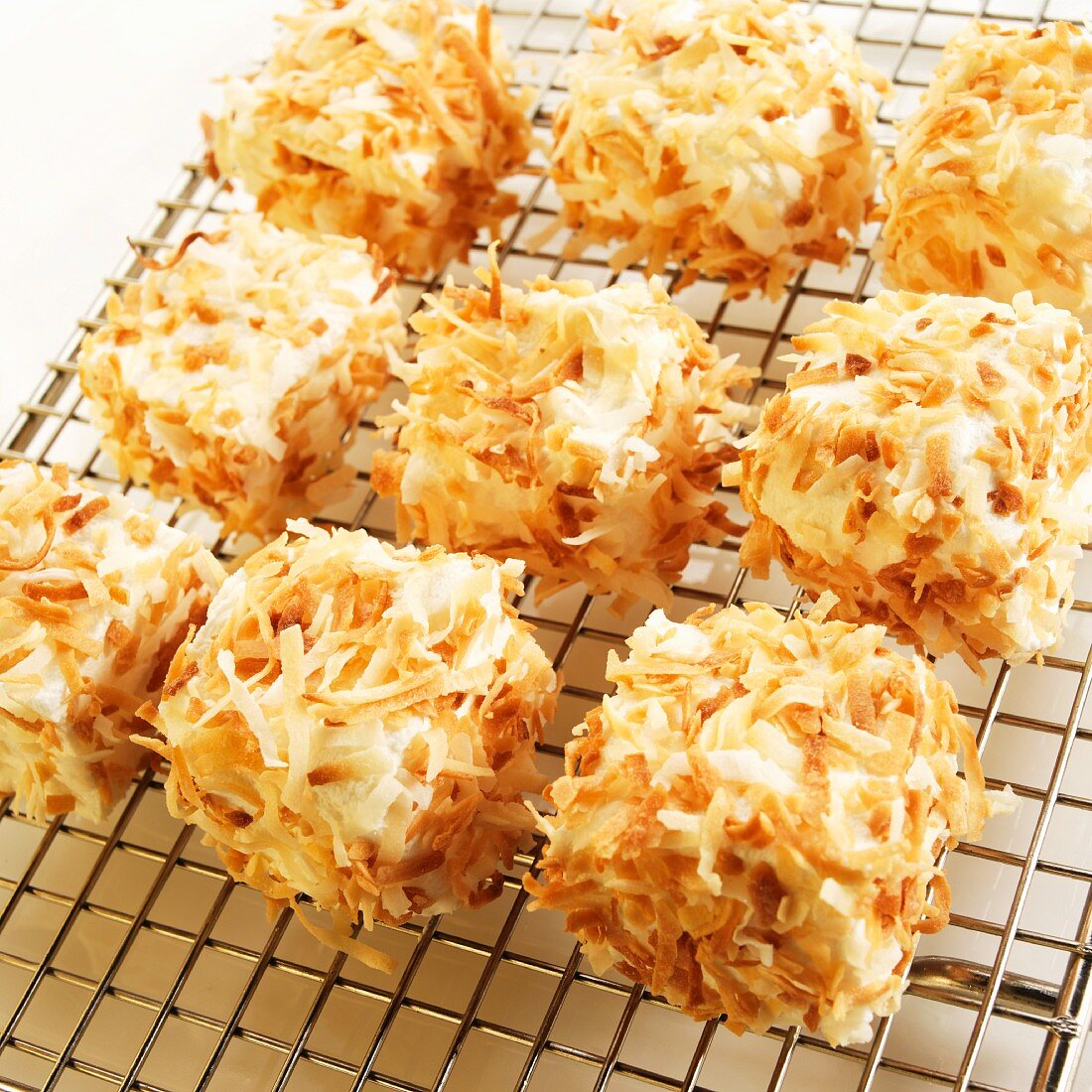 Homemade Marshmallows Covered with Toasted Coconut on a Cooling Rack