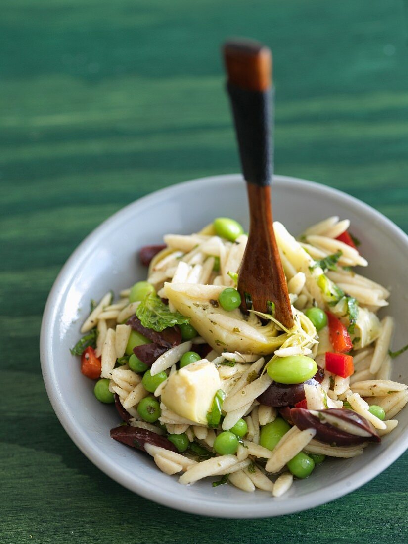 Orzo Salad with Artichoke Hearts, Olives and Peas; Wooden Spoon