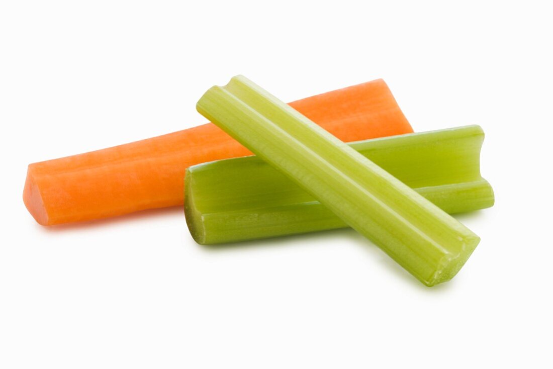 Two Celery Sticks and a Carrot Stick on a White Background