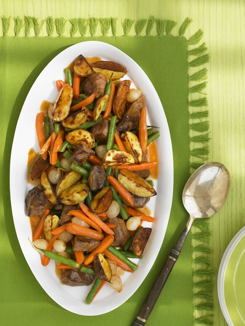 Beef, Potato, Green Bean and Carrot Roast on a Platter; From Above