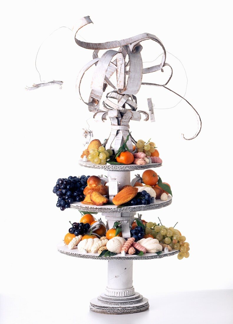 Original cake stand with pastries and fruit