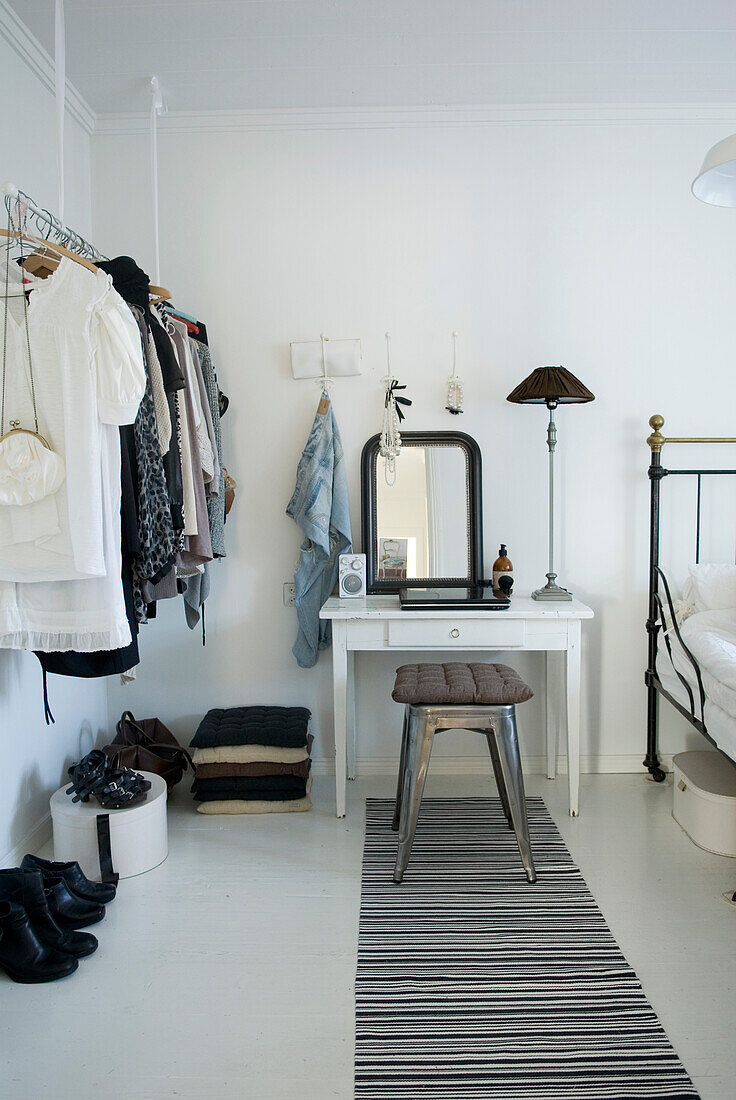 Clothes rack and dressing table in the bedroom