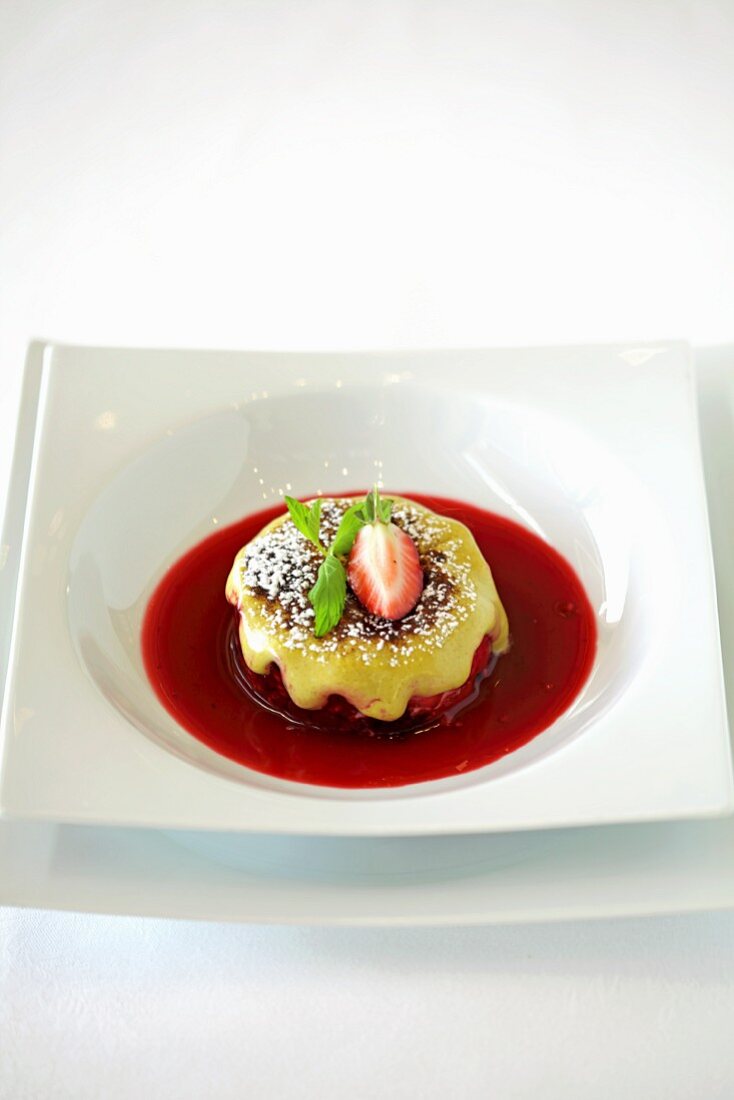 Strawberry dessert with fruit sauce