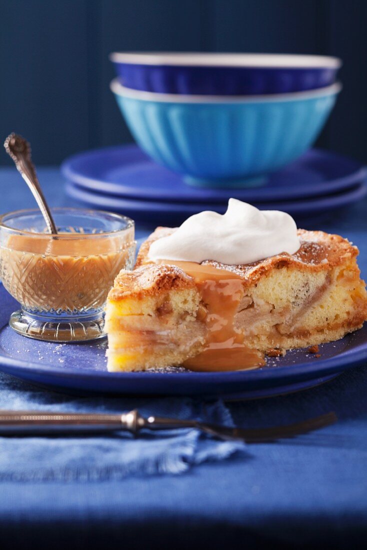 Apple and marzipan cake with caramel sauce and cream
