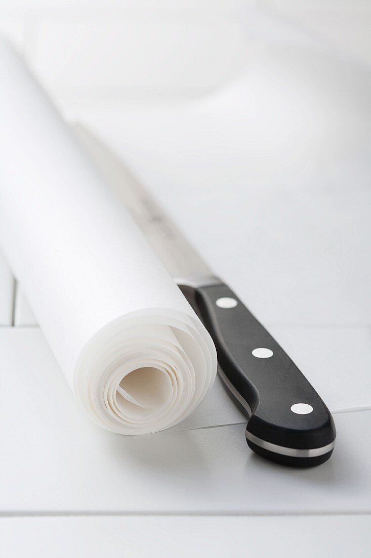 Roll of baking parchment and knife