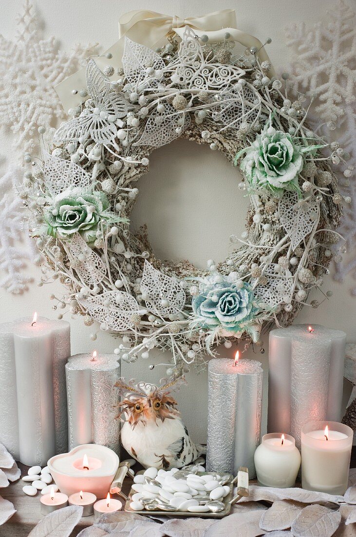 Decorative winter wreath and candles