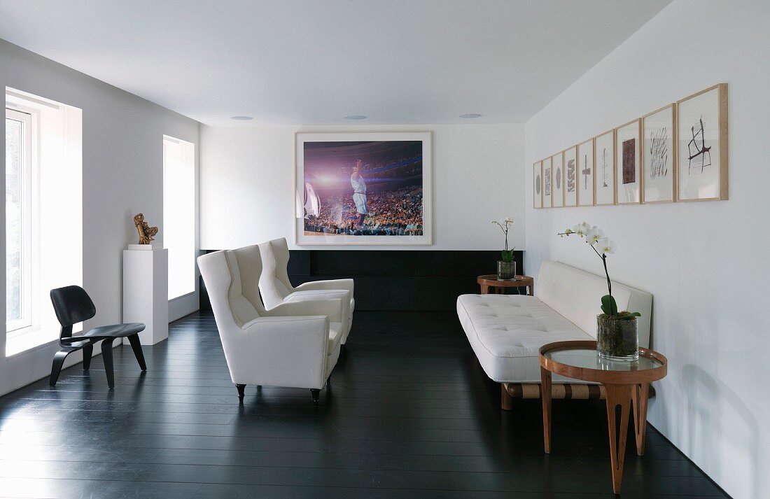 Living room with white armchairs and sofa