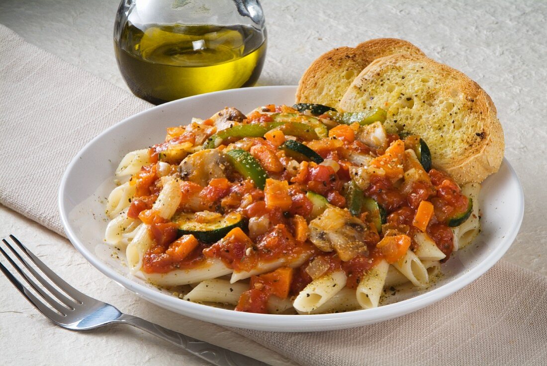 Penne with Vegetable Marinara Sauce and Two Pieces of Garlic Bread