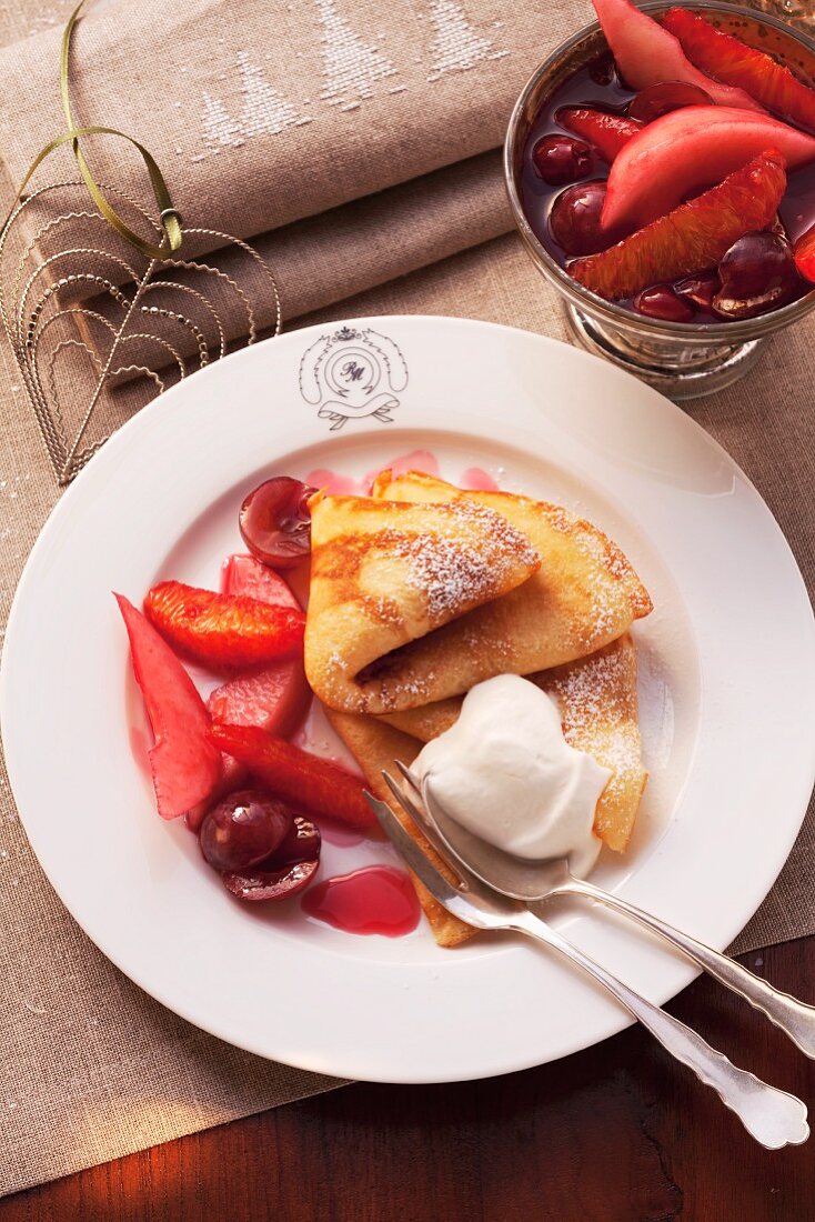 Crepes with rum fruits and cream